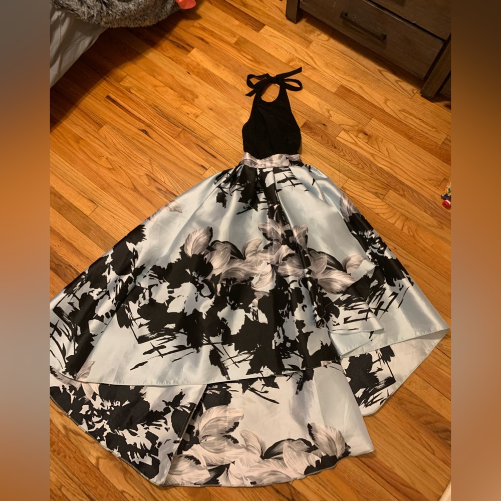 Light blue and Black halter dress, with a satin feeling and a little trail.